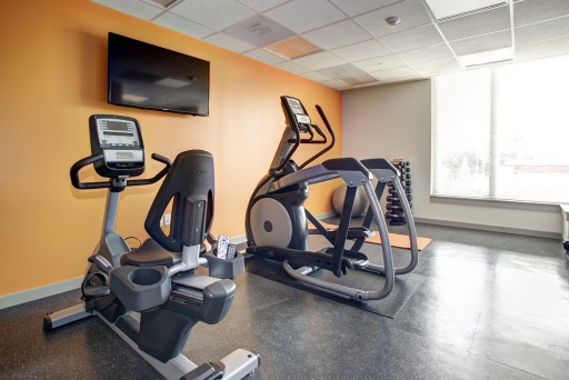Hodge on 7th apartments fitness center with exercise bike and elliptical machines