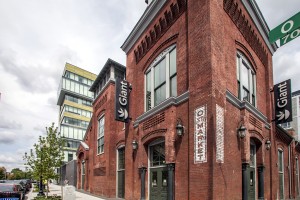 Giant food store at Hodge on 7th apartments - exterior red brick building view
