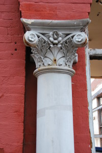 White column outside red building in Shaw neighborhood