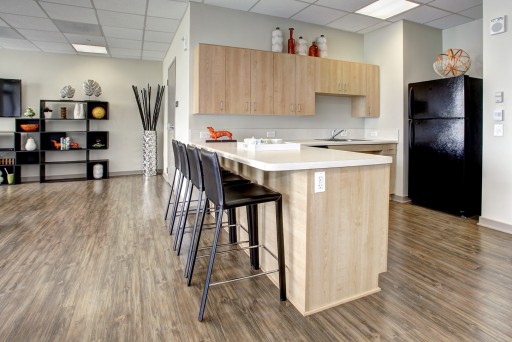 Hodge on 7th Kitchen with bar and tall chairs